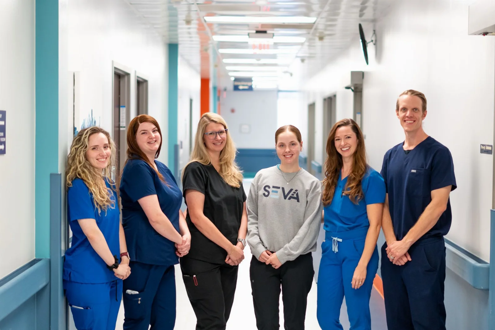 The SEVA Healthcare care team in a clinic corridor